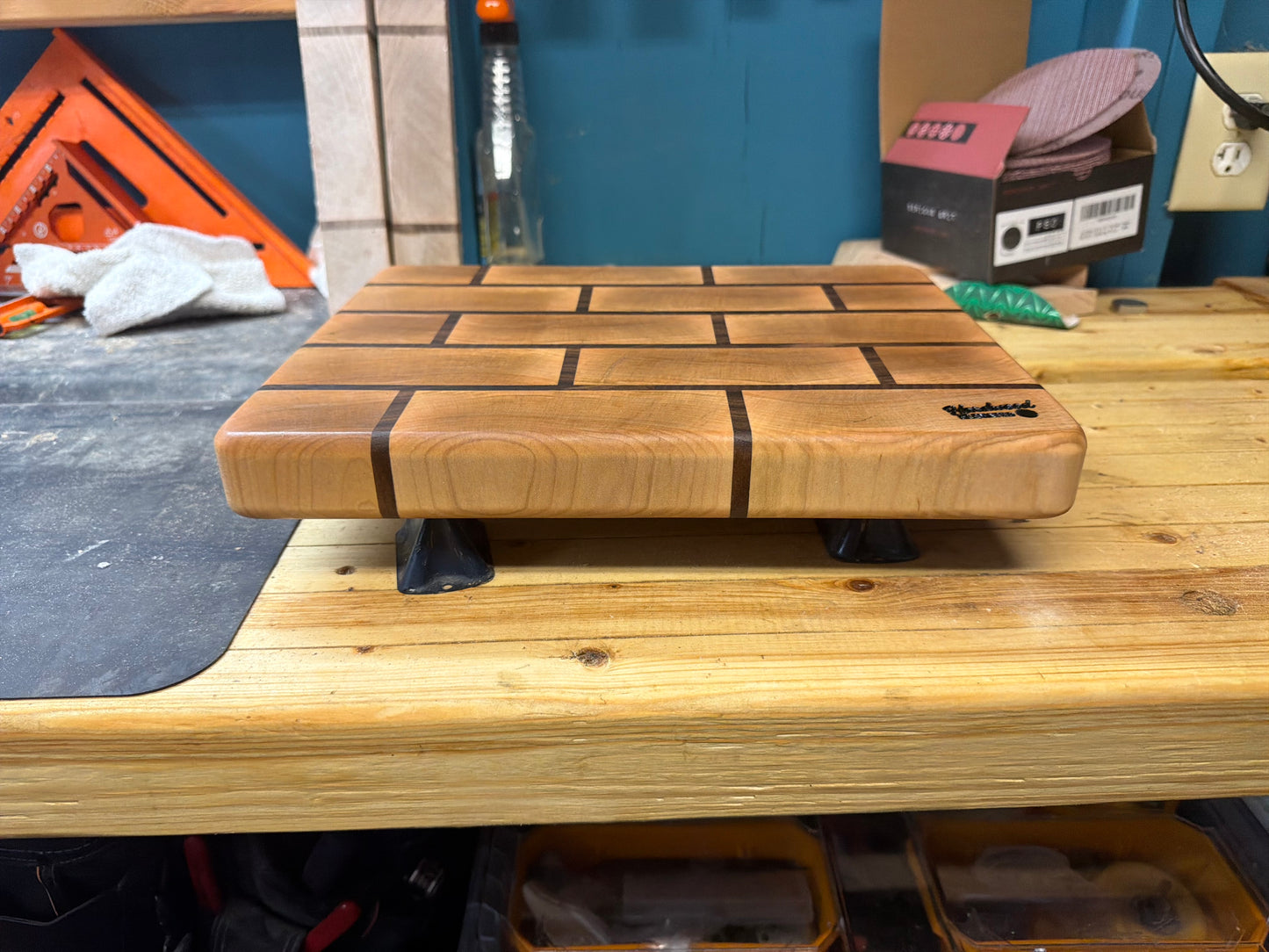 Maple end grain cutting board with walnut brick pattern, side profile showing thickness