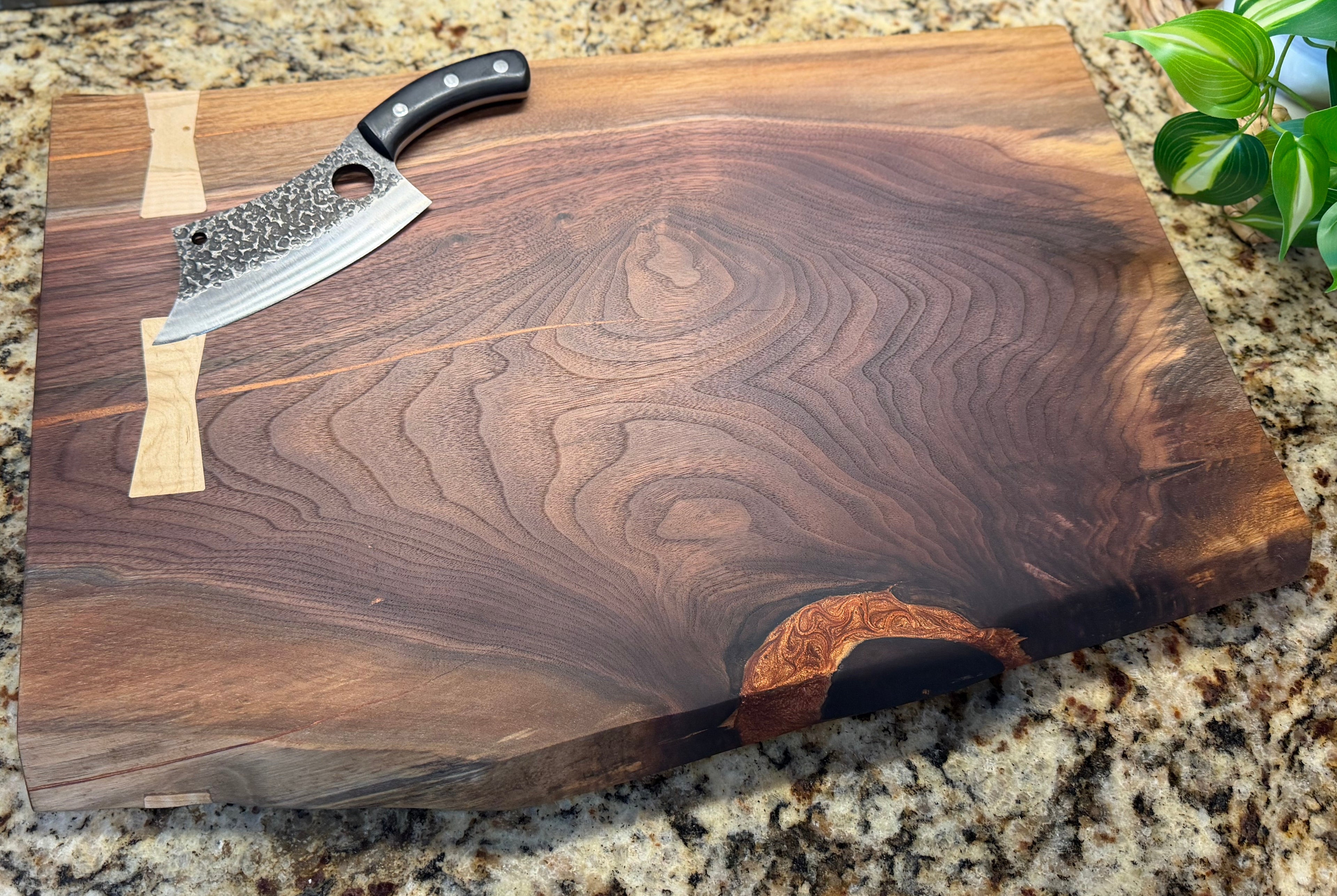 Solid walnut brisket board with live edge and maple bowtie keys